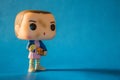Illustrative editorial of Funko Pop action figure of Eleven with eggos waffles, fictional character from the Netflix series Strang