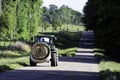 Illustrative Editorial of John Deere tractor hauling hay