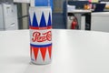 Illustrative editorial vintage design can of Pepsi-Cola brand in office for refreshment