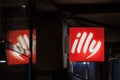Illy Caffe logo lit on a cafe bar of Belgrade, during the evening. Illy is one of the biggest coffee producers of Italy