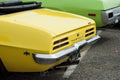 Closeup of yellow vintage american car rear from Pontiac brand parked at fun car show event Royalty Free Stock Photo