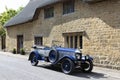 ILMINSTER, SOMERSET, ENGLAND - JUNE 6, 2018: Classic Blue Morris Oxford motor car outside a country cottage Royalty Free Stock Photo