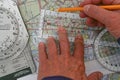 Ilot plots a flight on a sectional map for a vector from one airport to another.