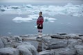 Young inuit woman in traditional clothing posing for photos in a small Greenlandish village. Royalty Free Stock Photo