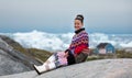Young inuit woman in traditional clothing posing for photos in a small Greenlandish village. Royalty Free Stock Photo