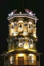 Close-up of illuminated clock tower of church of Saint Barbara at night, Santa Cruz de Mompox, Colombia, World Heritage Royalty Free Stock Photo