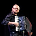 Ilya Shneyveys playing klezmer music on the accordion during a faculty concert at the Klezfest music festival, London UK