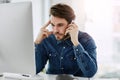 Im calling for the tenth time now... a handsome young businessman looking frustrated while making a phonecall in his Royalty Free Stock Photo