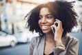 Im calling to find out more about that opportunity. a young businesswoman talking on a cellphone in the city. Royalty Free Stock Photo