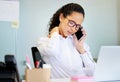 Im carrying all my tension in my neck. an attractive young businesswoman sitting alone in the office and suffering from Royalty Free Stock Photo