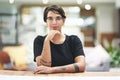 Im in charge of my own success. Cropped portrait of a young businesswoman sitting at her desk in her office. Royalty Free Stock Photo