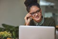 Im a deadline beater. Portrait of an attractive young woman working on her laptop in the office. Royalty Free Stock Photo