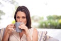 Im enjoying my day off. Portrait of an attractive young woman drinking coffee at home. Royalty Free Stock Photo