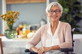 Im freshened up and ready to have my breakfast. Cropped portrait of a happy senior woman smiling while sitting in her Royalty Free Stock Photo