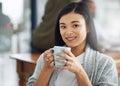 Im fuelling up for success. Portrait of a young businesswoman enjoying a cup of coffee. Royalty Free Stock Photo