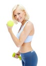 Im getting in shape. Sporty young woman lifting dumbbells while isolated on white. Royalty Free Stock Photo