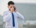 Im going to need a minute. Shot of a stressed businessman making a phone call using his smartphone. Royalty Free Stock Photo