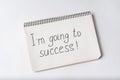 Im going to success, inscription in notebook. White background Royalty Free Stock Photo