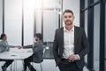 Im growing my business. Portrait of a handsome businessman standing in the boardroom during a meeting. Royalty Free Stock Photo