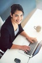 Im having an awesome day. High angle portrait of an attractive young businesswoman working on a laptop in her office. Royalty Free Stock Photo