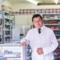 Im here to help you get better. Portrait of a male pharmacist in a pharmacy. Royalty Free Stock Photo