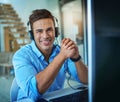 Im here to listen. a young man working in a call center. Royalty Free Stock Photo