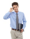 Im just a call away. Studio shot of a young businessman talking a cellphone isolated on white. Royalty Free Stock Photo