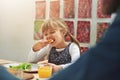 Im just here for the pizza. a family enjoying pizza at home.