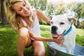 Im just thinking of the treats Ill get afterwards. a woman bathing her pet dog outside on a summers day. Royalty Free Stock Photo