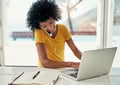 Im looking at it now...an attractive young woman working on her laptop at home. Royalty Free Stock Photo