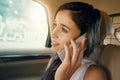 Im on my way, please be patient a little longer. Closeup shot of an attractive young businesswoman sitting inside a car