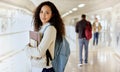 Im off to class. Cropped portrait of an attractive young female college student standing with her textbooks in a campus Royalty Free Stock Photo