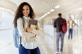 Im ready for class. Cropped portrait of an attractive young female college student standing with her textbooks in a Royalty Free Stock Photo