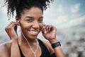 Im so ready to rock this workout. Portrait of a sporty young woman listening to music while exercising outdoors. Royalty Free Stock Photo