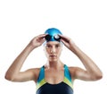 Im ready to take you on. Cropped portrait of a young female swimmer isolated on white. Royalty Free Stock Photo