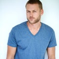 Im serious about my style. Studio shot of a handsome young man posing against a white background. Royalty Free Stock Photo