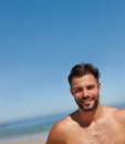 Im a sun worshipper. a young man enjoying a day at the beach. Royalty Free Stock Photo