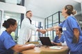 Im thrilled to have you join our team. doctors shaking hands during a meeting in a hospital. Royalty Free Stock Photo