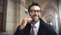 Im in town...where are you. a stylish man speaking on his phone in the city. Royalty Free Stock Photo