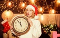 Im waiting. xmas mood. Woman wi clock. girl in red santa claus hat. Midnight. Cheerful woman.. Time to celebrate. winter Royalty Free Stock Photo