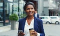 Im well connected in the business world. Shot of an attractive young businesswoman holding her cup of coffee and a Royalty Free Stock Photo