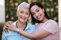 Im the woman I am thanks to my mom. a senior woman spending time with her daughter in their garden at home. Royalty Free Stock Photo