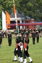 IMA passing out parade, officer passing the regimental flag to cadet.