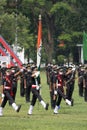 IMA passing out parade, officer passing the regimental flag to cadet.