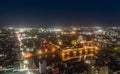 Imabari Castle rises above lights from sprawling cityscape at night