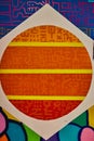 Abstract of orange sun with yellow lines and techno alien symbols or hieroglyphics