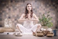 Image of an adult woman in yoga place. Meditation. The concept of yoga and spiritual practices