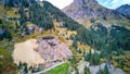 Aerial of abandoned and falling apart mill in the mountains