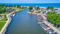 Aerial above of water canal river with dock, boats, and view of large lake