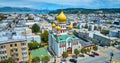 Aerial Holy Virgin Cathedral with Golden Gate Bridge in background